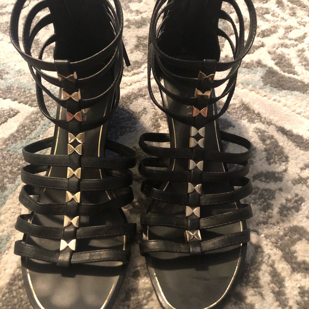 Black gladiator sandals.